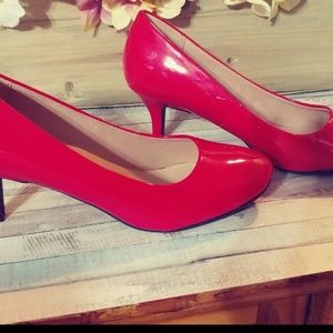 Red patent pumps